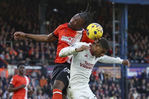 Hojlund scores early double and Man United hangs on for win at